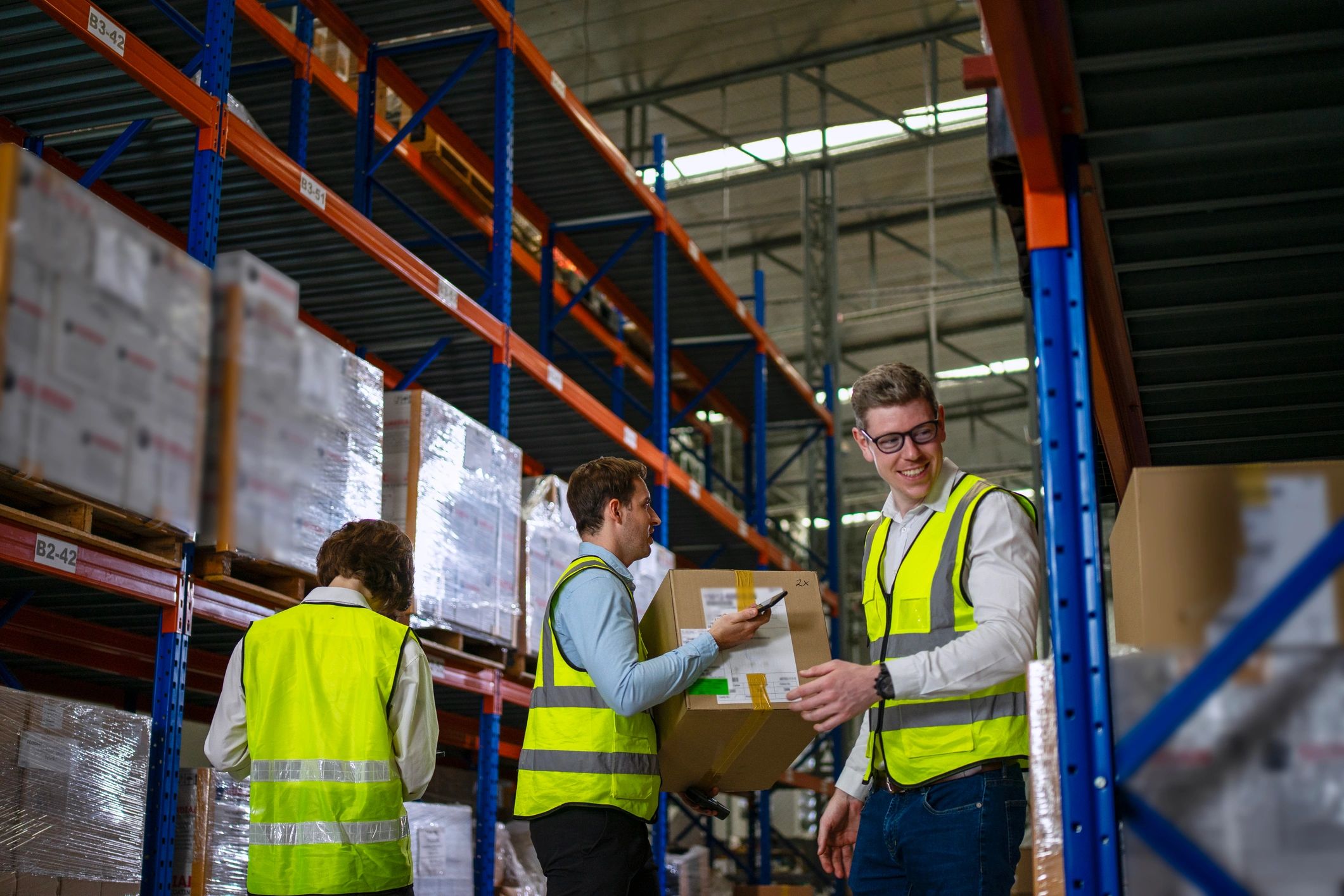 Warehouse team preparing packaged goods for dispatch